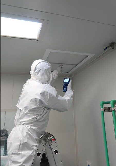 IAFS technician scanning a ceiling air supply panel