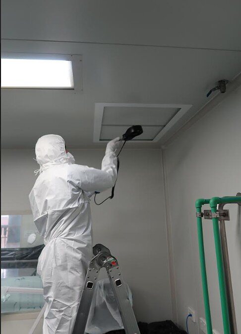 IAFS technician performing air flow testing in a controlled environment